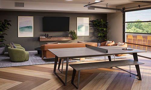 room with a ping pong table and large window