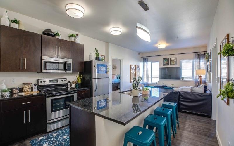 a kitchen with an island and seating